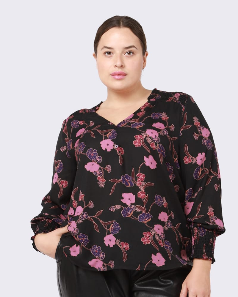Front of a model wearing a size 0X Ella Smocked Shoulder Top in Purple Peonies by DEX PLUS. | dia_product_style_image_id:239818